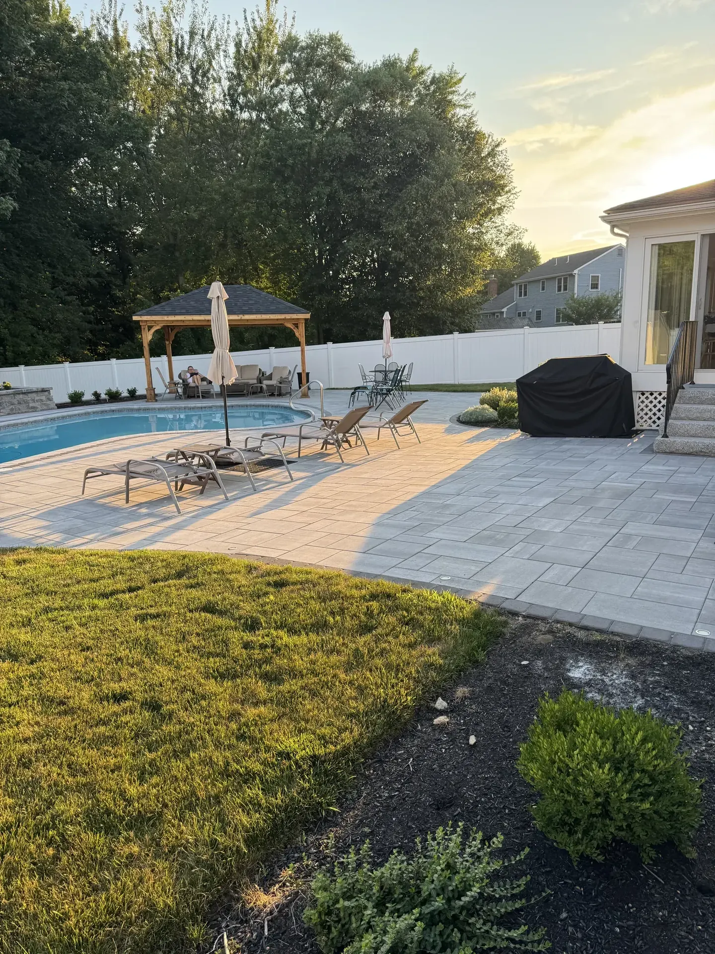 Pool deck and walkway in the evening in Reading, MA